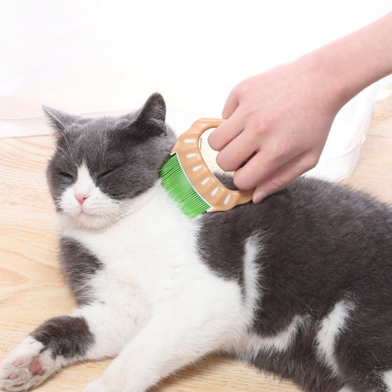 Shell-Shaped Grooming Brush, for dogs and cats.