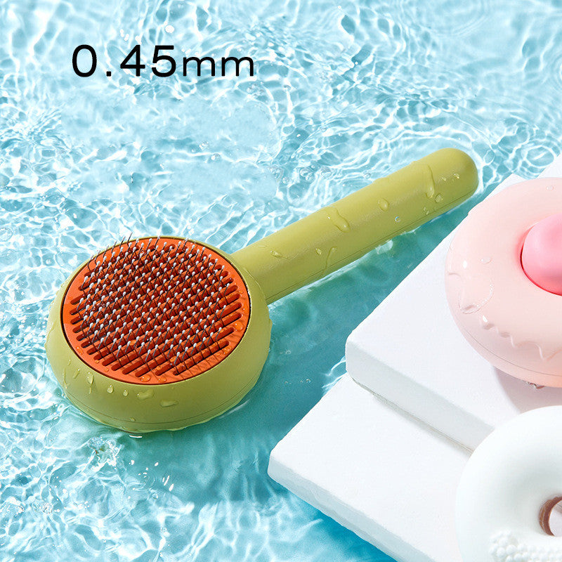 Donut-Shaped Massage Grooming Comb, for dogs and cats.